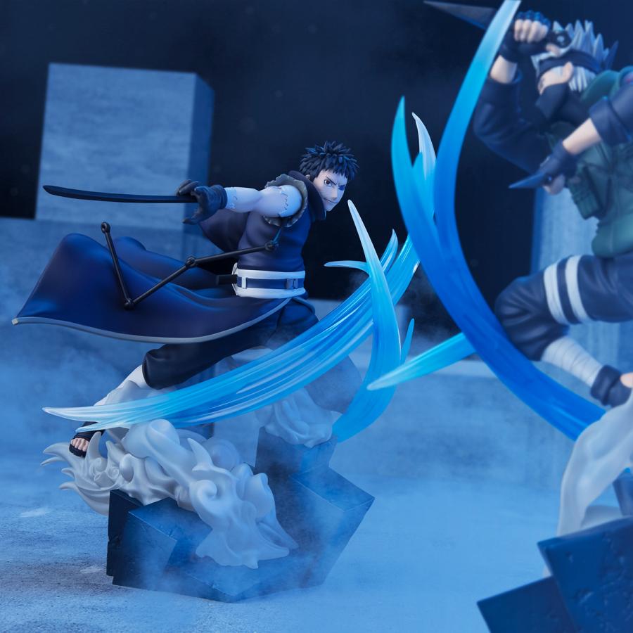 Figurine d'Obito Uchiha en pleine attaque dynamique, représentant le combat intense contre Kakashi Hatake dans Naruto Shippuden. Modèle Figuarts Zero de 20 cm de hauteur par Bandai, détaillant la force et la détermination d'Obito en pleine action.